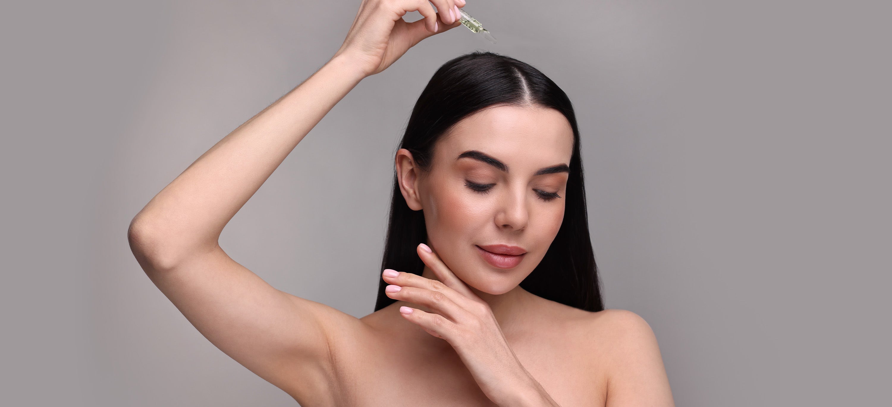 Woman with long straight hair using Moibon.