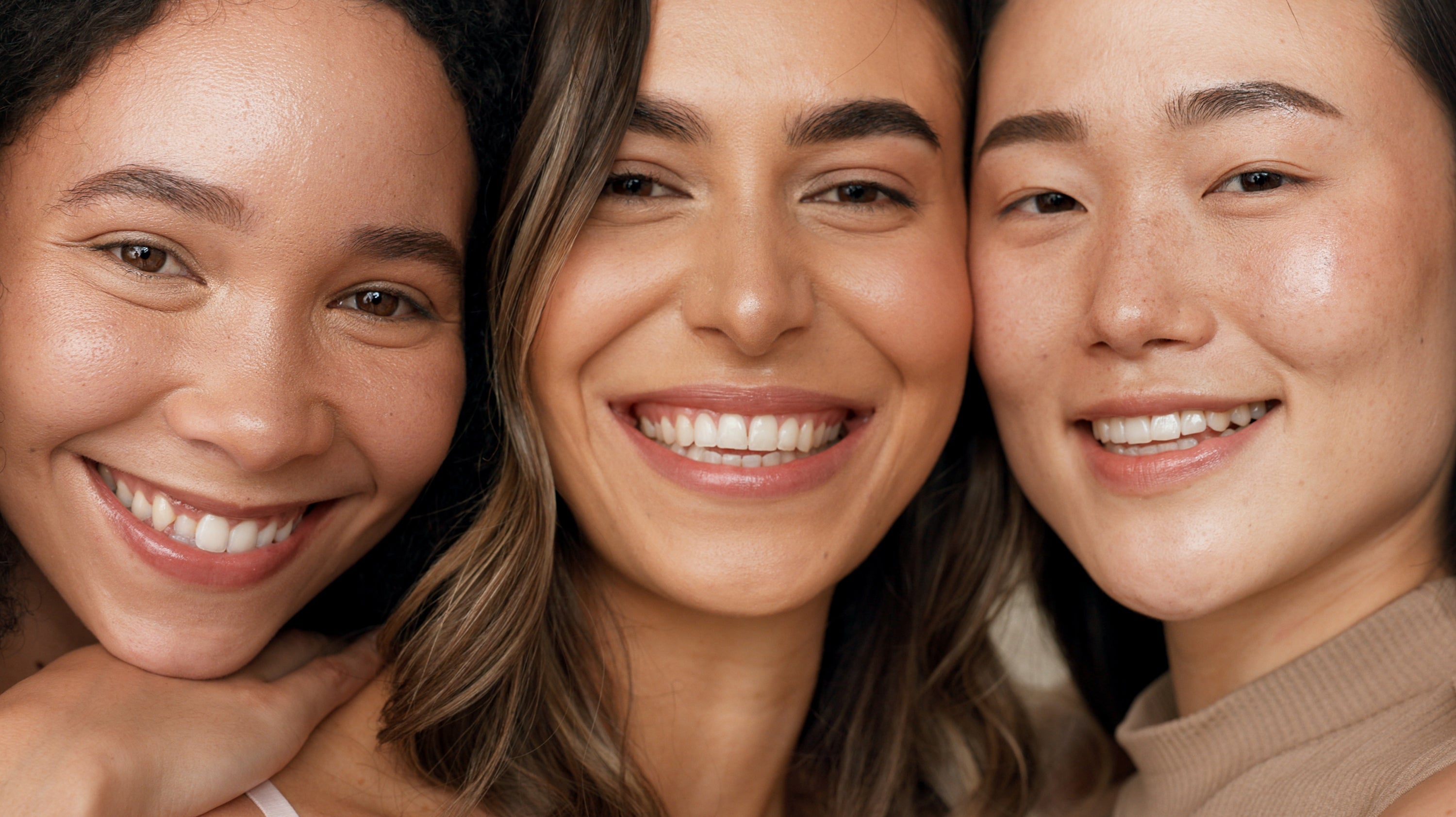 3 girls smiling.